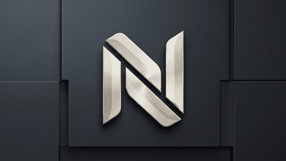 The Nessco monogram, machined in brushed steel and mounted on a panelled wall.